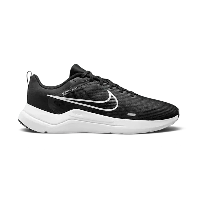 Nike Downshifter 12 Men's training shoes in black with a white midsole, side profile showing mesh upper, foam cushioning, and Nike Swoosh.