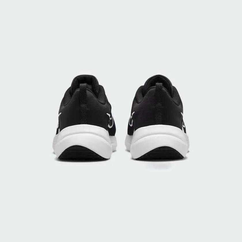 Rear view of the Nike Downshifter 12 Men's black training shoes, focusing on the structured heel and subtle branding.
