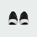 Rear view of the Nike Downshifter 12 Men's black training shoes, focusing on the structured heel and subtle branding.