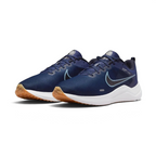 Angled view of two Nike Downshifter 12 Men's navy blue and white training shoes, side by side, showcasing their versatile design and cushioned profile.