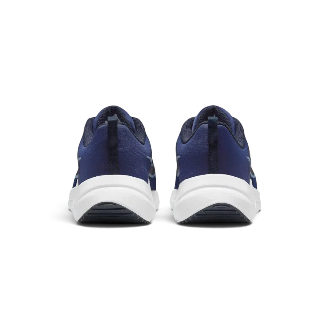 Rear view of the Nike Downshifter 12 Men's navy blue training shoes, focusing on the structured heel and subtle branding.
