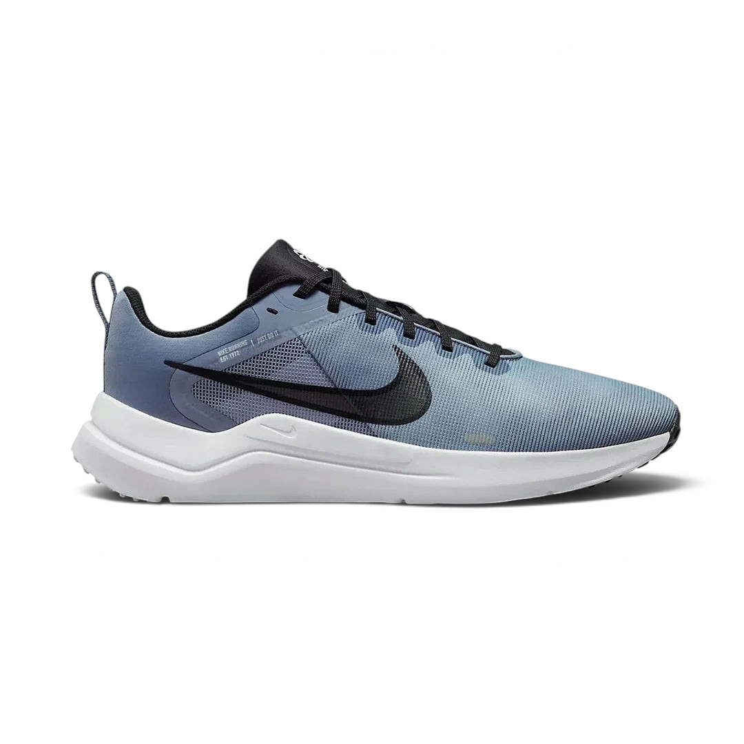Nike Downshifter 12 Men's training shoes in grey with black and blue accents, side profile showing mesh upper, foam cushioning, and Nike Swoosh. Main image