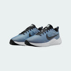 Angled view of two Nike Downshifter 12 Men's grey and black training shoes, side by side, showcasing their versatile design and cushioned profile.