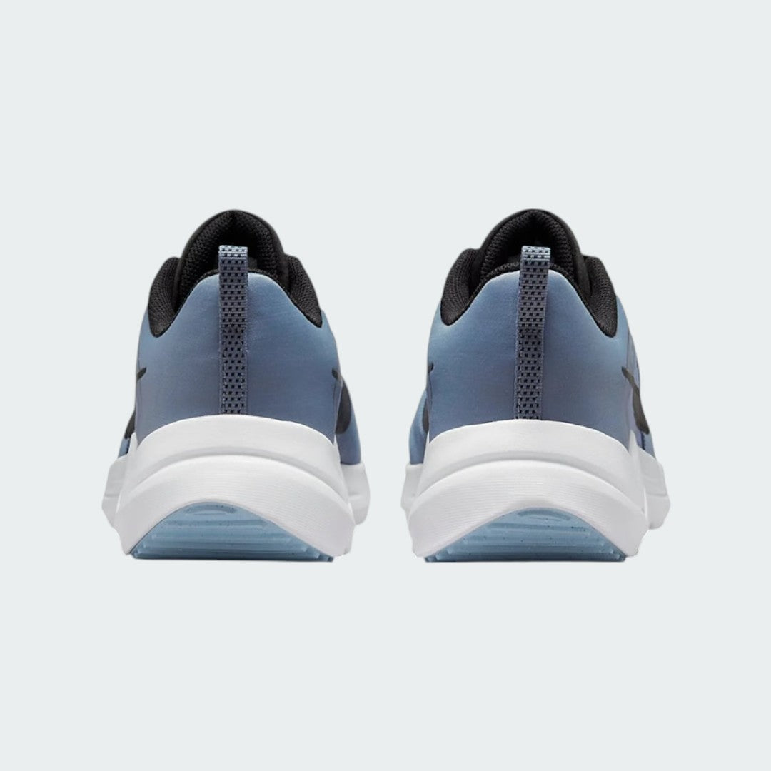 Rear view of the Nike Downshifter 12 Men's grey training shoes, focusing on the structured heel and subtle branding.