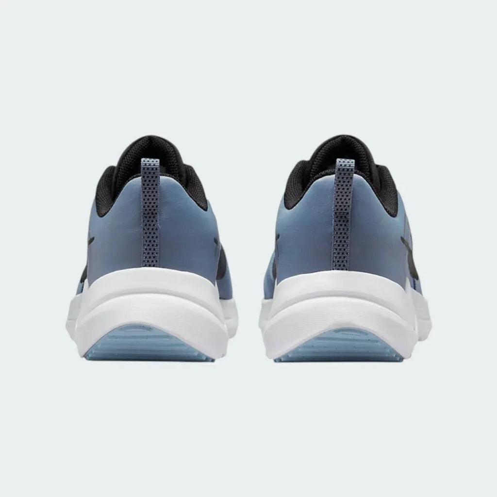 Rear view of the Nike Downshifter 12 Men's grey training shoes, focusing on the structured heel and subtle branding.
