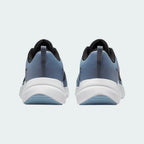 Rear view of the Nike Downshifter 12 Men's grey training shoes, focusing on the structured heel and subtle branding.