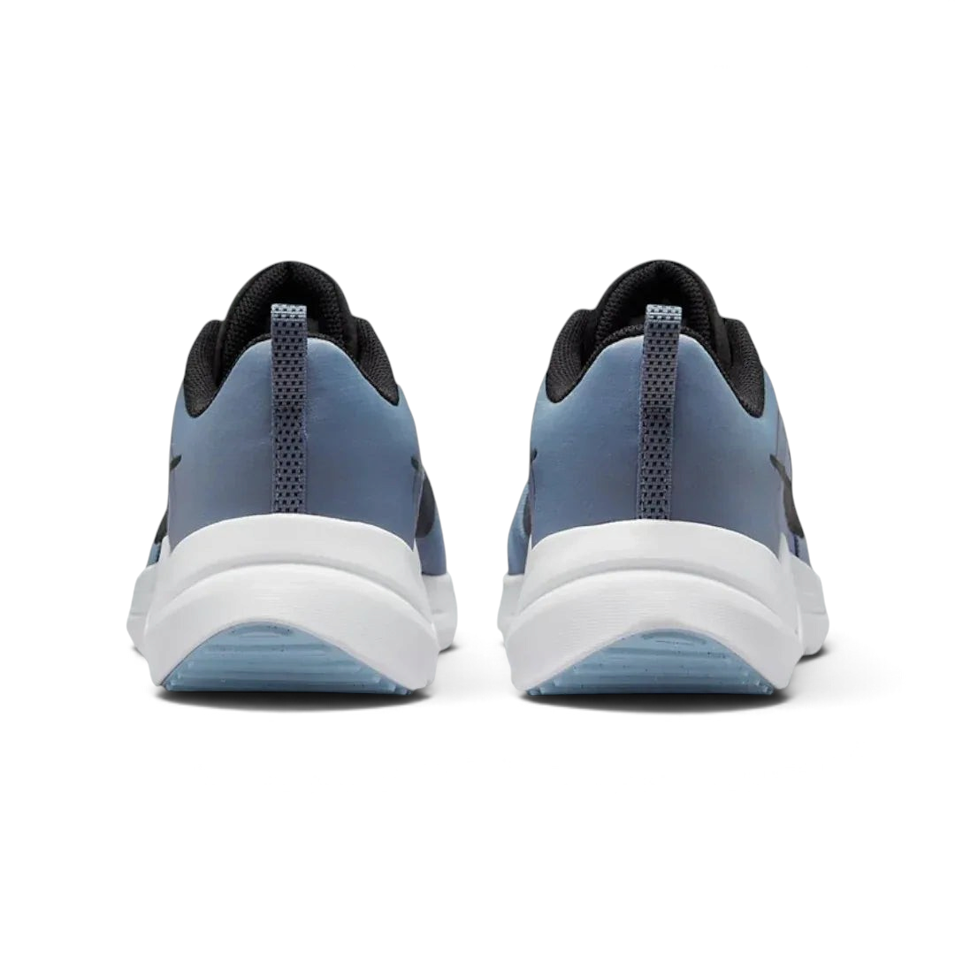 Rear view of the Nike Downshifter 12 Men's grey training shoes, focusing on the structured heel and subtle branding.