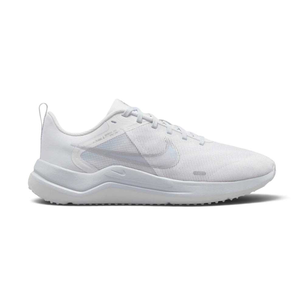 Highlights the high-velocity Metallic Silver Nike Swoosh slashing across the professional depth of the Pure Platinum mesh upper and the sculpted white midsole wall. Main image