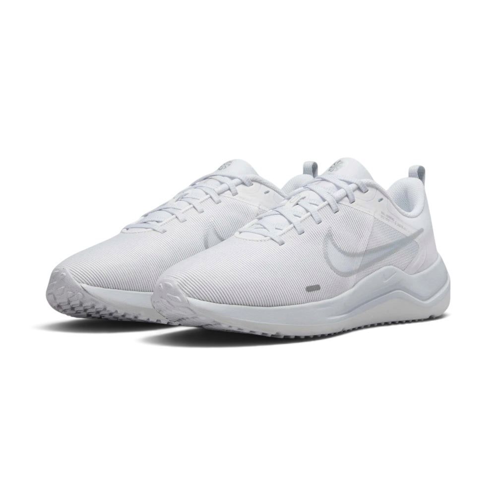 Emphasising the low-profile aerodynamic athletic silhouette and the professional harmony of the clean white panels.