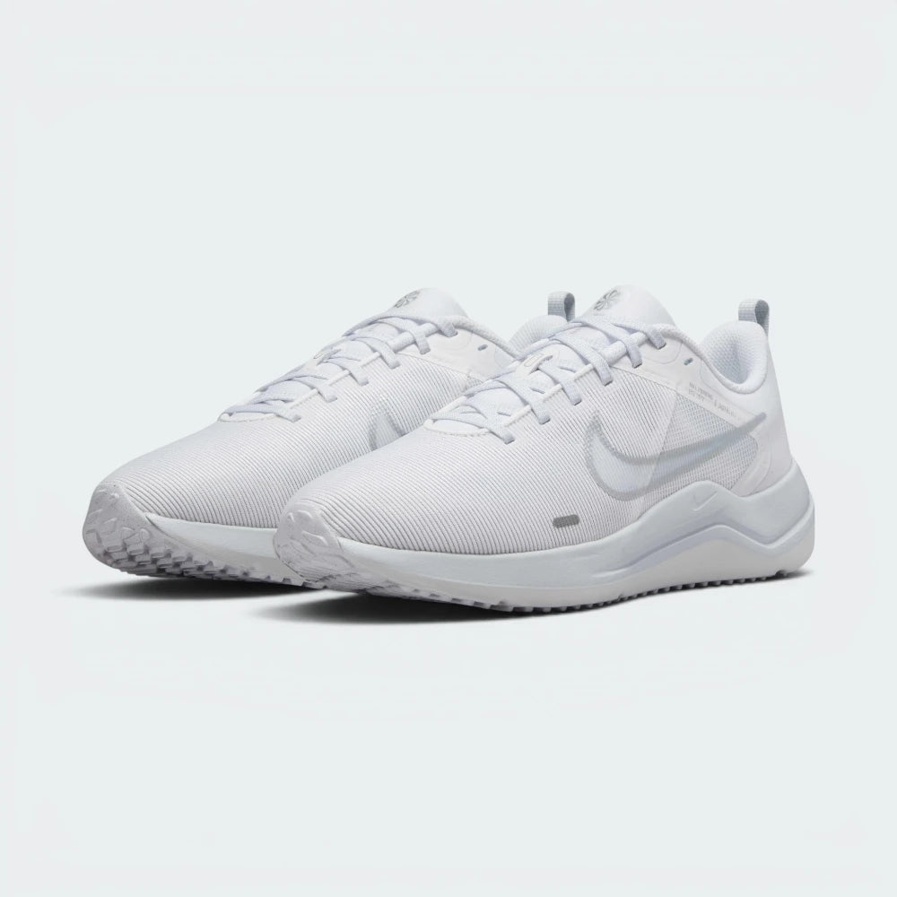 Emphasising the low-profile aerodynamic athletic silhouette and the professional harmony of the clean white panels.