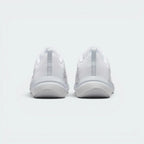 Focuses on the contoured mesh heel collar structure and the clean finish of the raised, protective rear foam sole.
