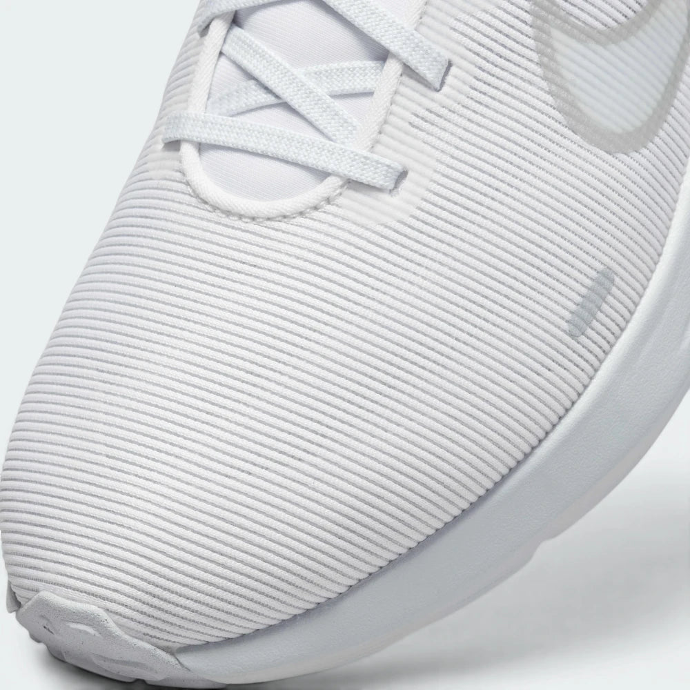 Details the high-definition micro-perforations across the forefoot cooling zones and the precision skin reinforcements over the eyelets.
