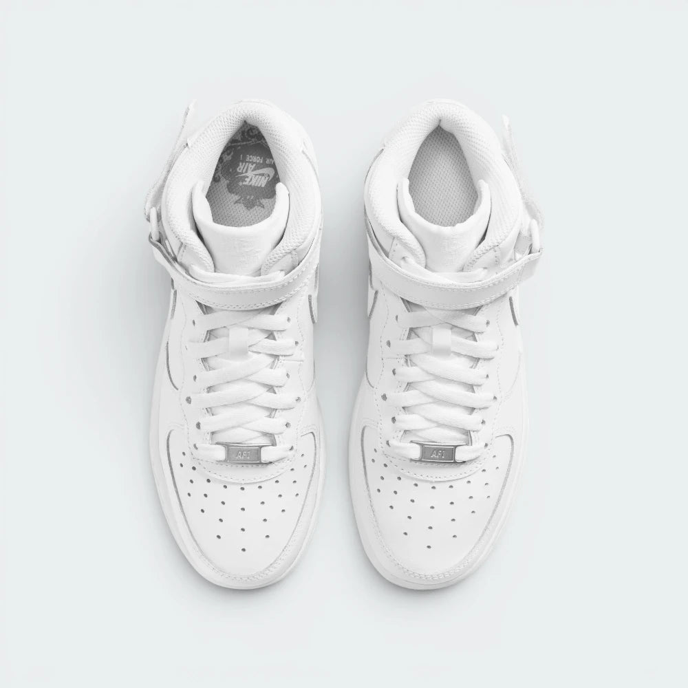 Focuses on the locked-in traditional lacing layout, displaying the perfect symmetry of the white textile tongue, the classic metal lace dubrae, and the neat rows of perforations guarding the front toe box area.