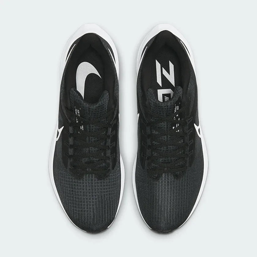 Overhead view of the running shoes, highlighting the engineered mesh ventilation zones and the integrated Flywire lacing.
