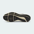 View of the outsole of the Nike Air Zoom Pegasus 39 Men's green running trainers, showing the durable rubber waffle-inspired tread pattern for road traction.