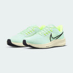 Angled view of two Nike Air Zoom Pegasus 39 Men's green running trainers, side by side, showcasing their responsive design and athletic profile.
