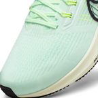 Close-up zoom on the front of the Nike Air Zoom Pegasus 39 Men's green running trainers, showing the breathable engineered mesh texture and integrated lacing system with Flywire cables.