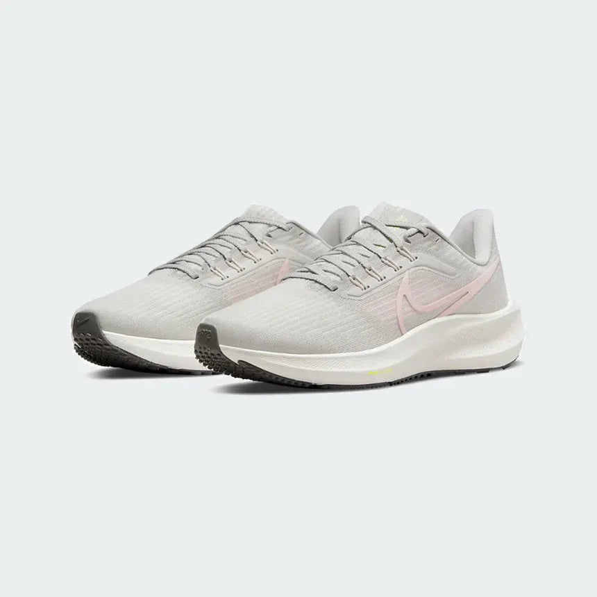 Angled view of two Nike Air Zoom Pegasus 39 Women's grey running trainers, side by side, showcasing their responsive design and athletic profile.