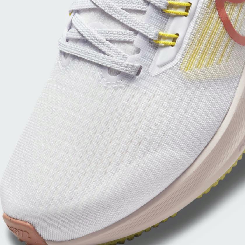 Zoom Looking at the Front of the Shoes and Laces: A close-up of the breathable engineered mesh and the integrated Flywire cables.