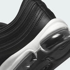 Detailed zoom on the outsole and midsole of the Nike Air Max 97 Women's black trainers, highlighting the full-length Max Air unit and durable rubber outsole.