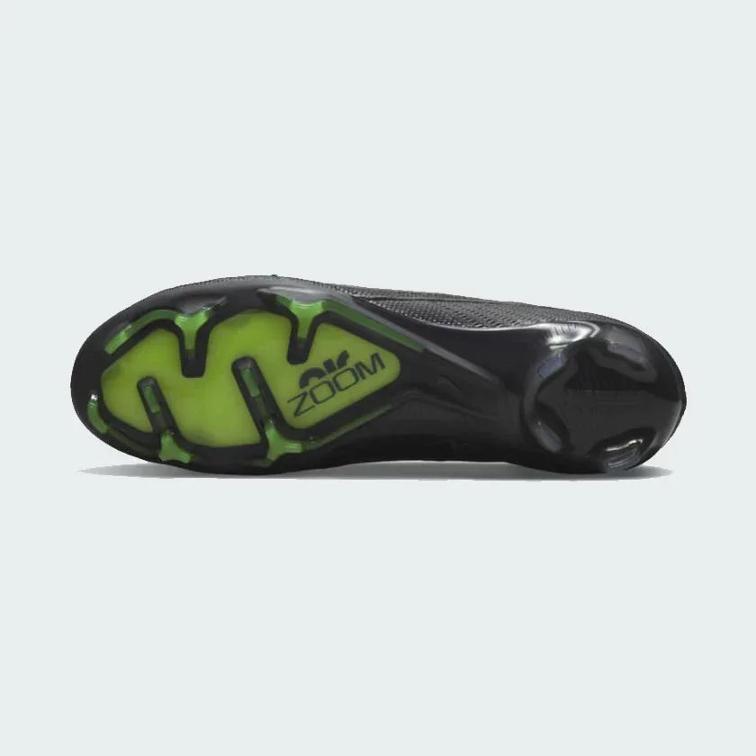Close-up of the Nike Zoom Superfly 9 Elite FG men's football boot outsole, highlighting Tri-star studs and visible Zoom Air unit for firm ground.