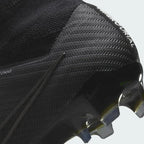 Zoomed-in view of the Nike Zoom Superfly 9 Elite FG football boot's outsole, detailing the Tri-star stud configuration, midsole, and integrated Zoom Air cushioning.