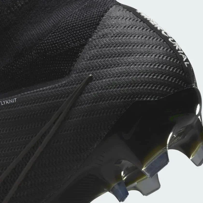 Zoomed-in view of the Nike Zoom Superfly 9 Elite FG football boot's outsole, detailing the Tri-star stud configuration, midsole, and integrated Zoom Air cushioning.