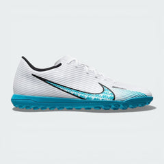 Side profile of the White and Baltic Blue Nike Mercurial Vapor 15 Club TF, showcasing the sleek aerodynamic shape and Pink Blast "AIR" branding.