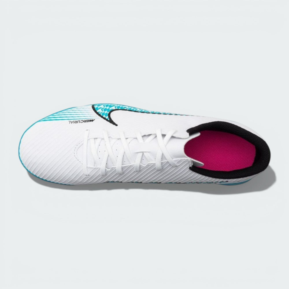 Overhead view of the turf boots, highlighting the central lacing system and the micro-textured synthetic upper.