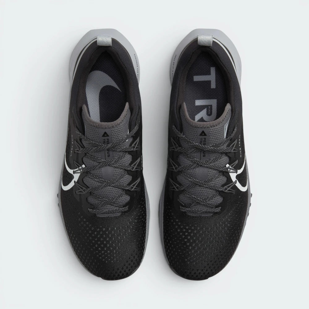 Focuses on the locked-in lacing layout, displaying the exact integration of the Flywire cables along the sides and the streamlined, skin-protected engineered mesh toe box area.