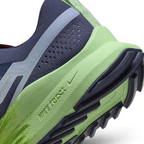 Detailed zoom on the outsole and midsole of the Nike React Pegasus Trail 4 Men's blue running shoes, highlighting the responsive React foam cushioning and rugged rubber outsole.
