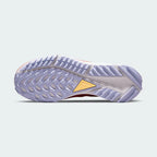 View of the outsole of the Nike Pegasus Trail 4 Women's pink running shoes, showing the durable, trail-ready rubber traction pattern.