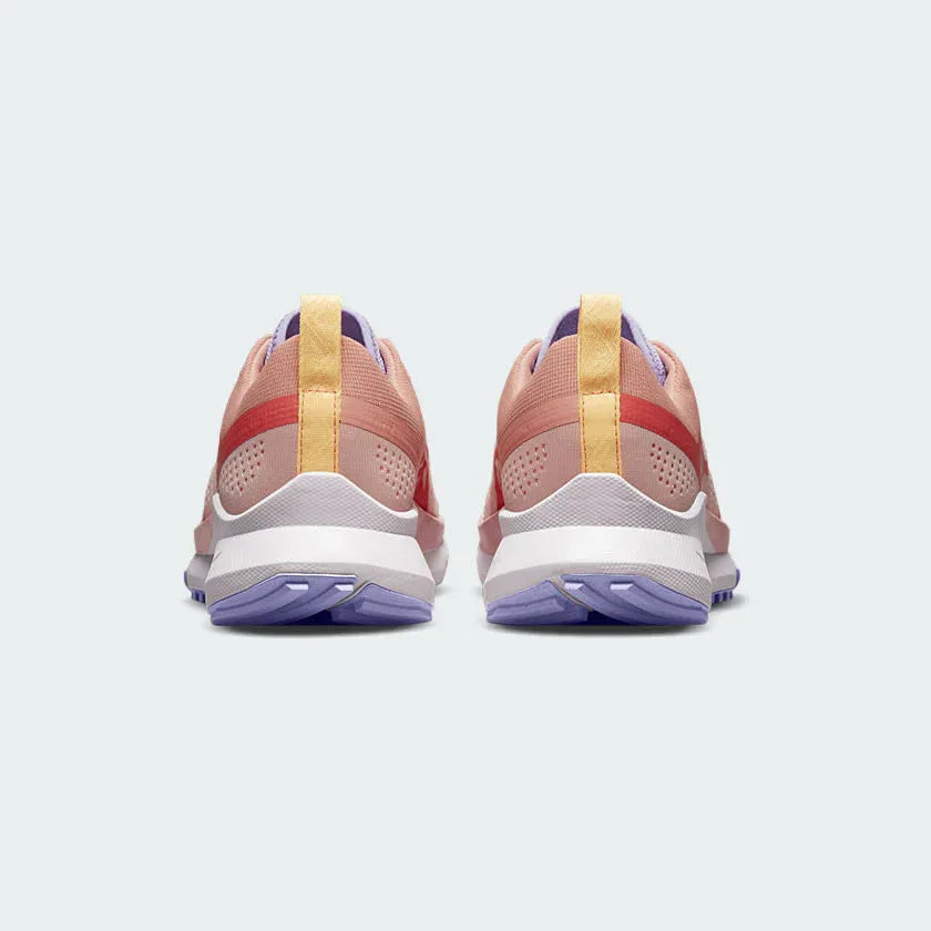 Rear view of the Nike Pegasus Trail 4 Women's pink running shoes, focusing on the structured heel and reflective details.