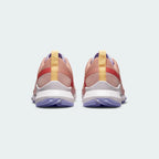 Rear view of the Nike Pegasus Trail 4 Women's pink running shoes, focusing on the structured heel and reflective details.