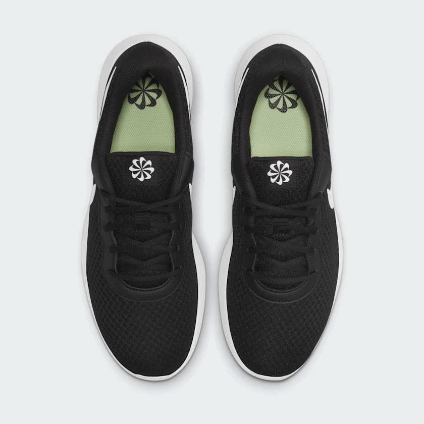 Nike Tanjun Men's Black Trainers DJ6258 angled side view showing low-cut profile and foam midsole