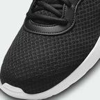 Close-up of Nike Tanjun Men's Black Trainers DJ6258 laces, mesh texture, and collar padding