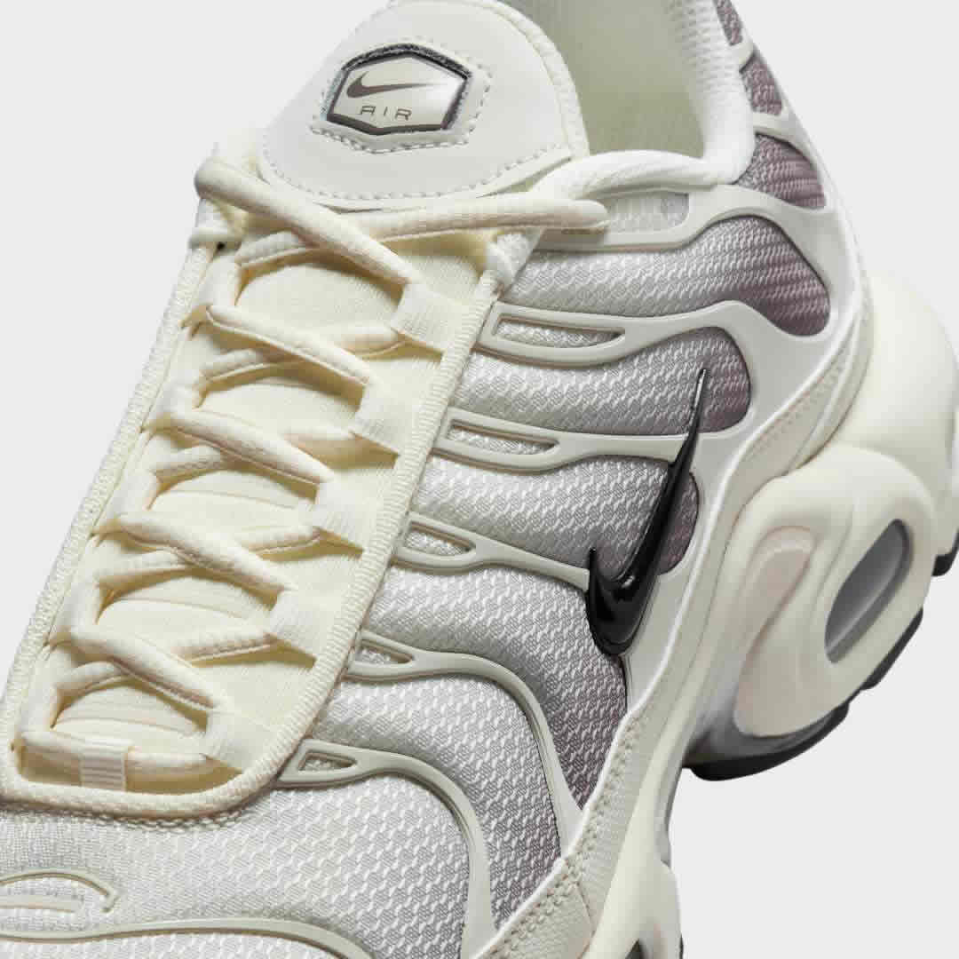 Close-up zoom on the front of the Nike Air Max Plus TN Men's trainers, showing the mesh toe box, lacing system, and intricate wavy overlays.