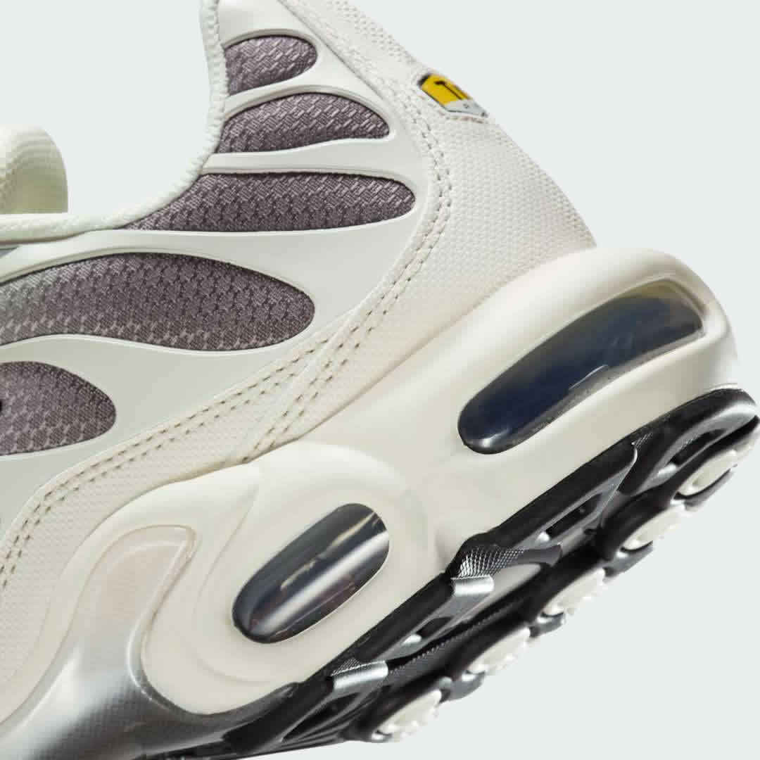 Detailed zoom on the outsole and midsole of the Nike Air Max Plus TN Men's trainers, highlighting the unique Tuned Air cushioning system and rubber outsole.