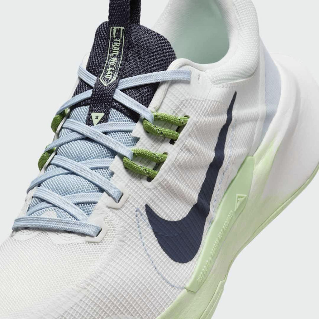 Close-up of Nike Juniper Trail 2 Women's White Trail Shoes DM0821-103 mesh texture, lacing system, and tongue logo