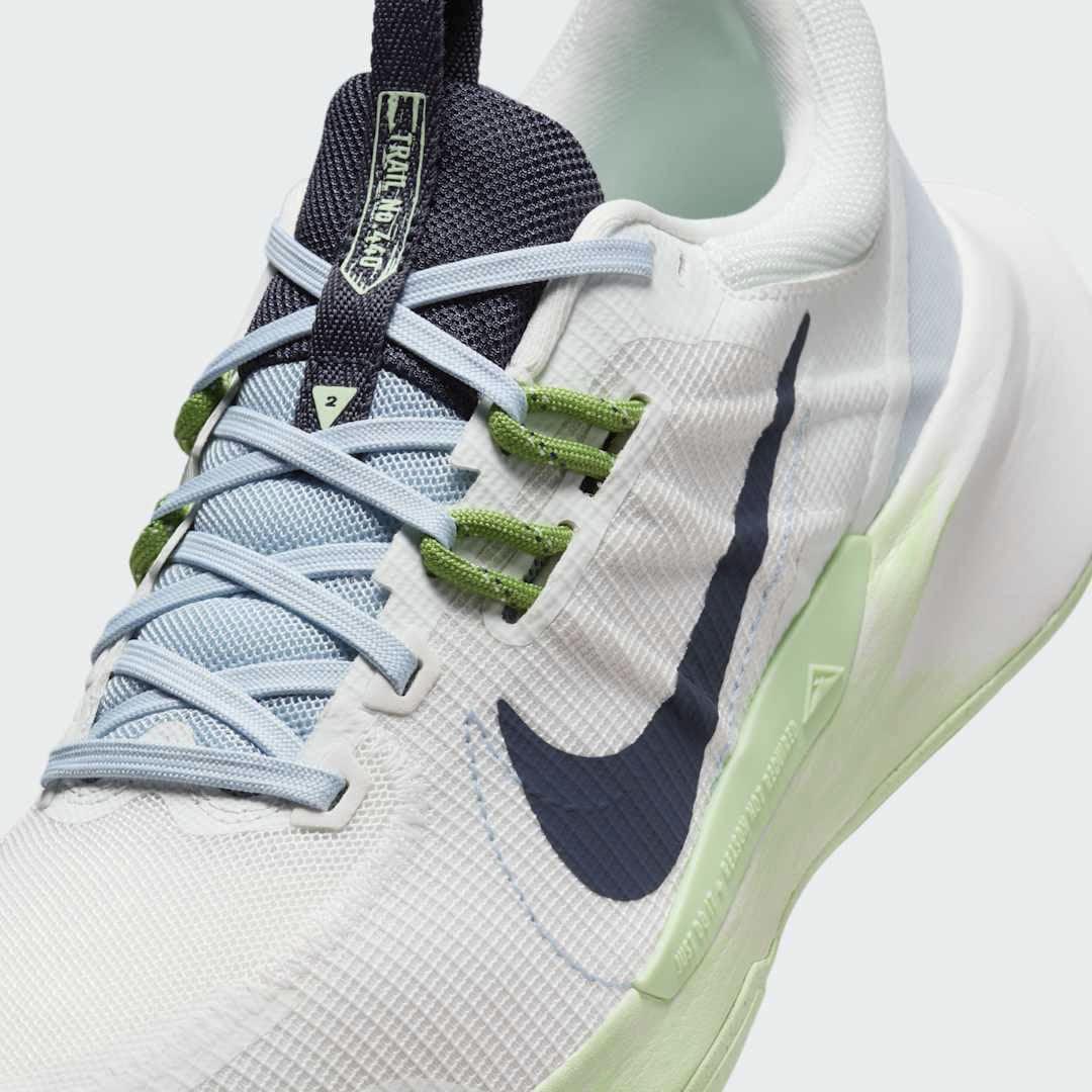 Close-up of Nike Juniper Trail 2 Women's White Trail Shoes DM0821-103 mesh texture, lacing system, and tongue logo