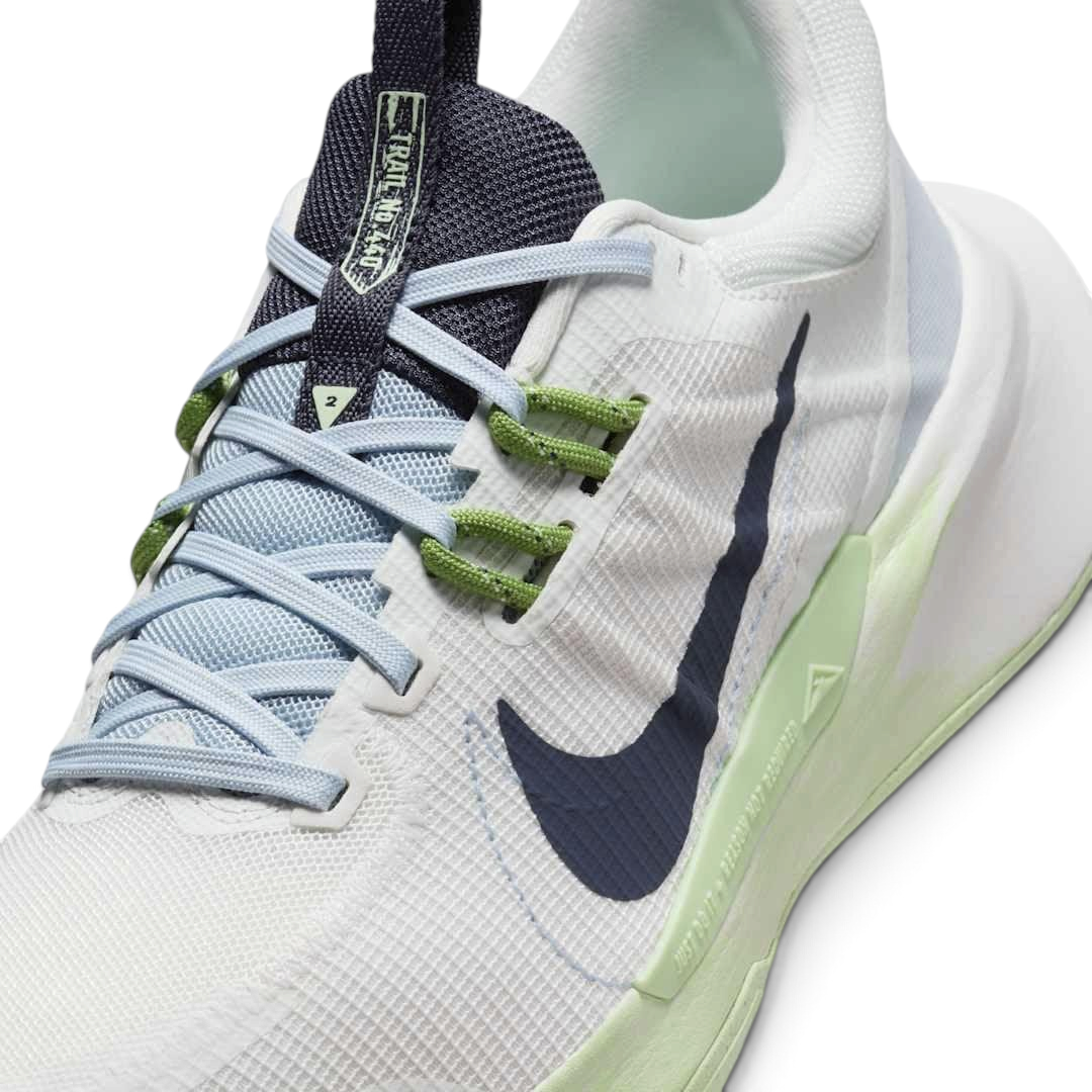 Close-up of Nike Juniper Trail 2 Women's White Trail Shoes DM0821-103 mesh texture, lacing system, and tongue logo