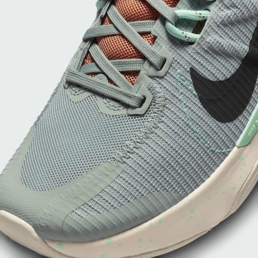 Close-up of Nike Juniper Trail 2 Women's Running Shoes DM0821-301 mesh texture, eyelets, and tongue logo