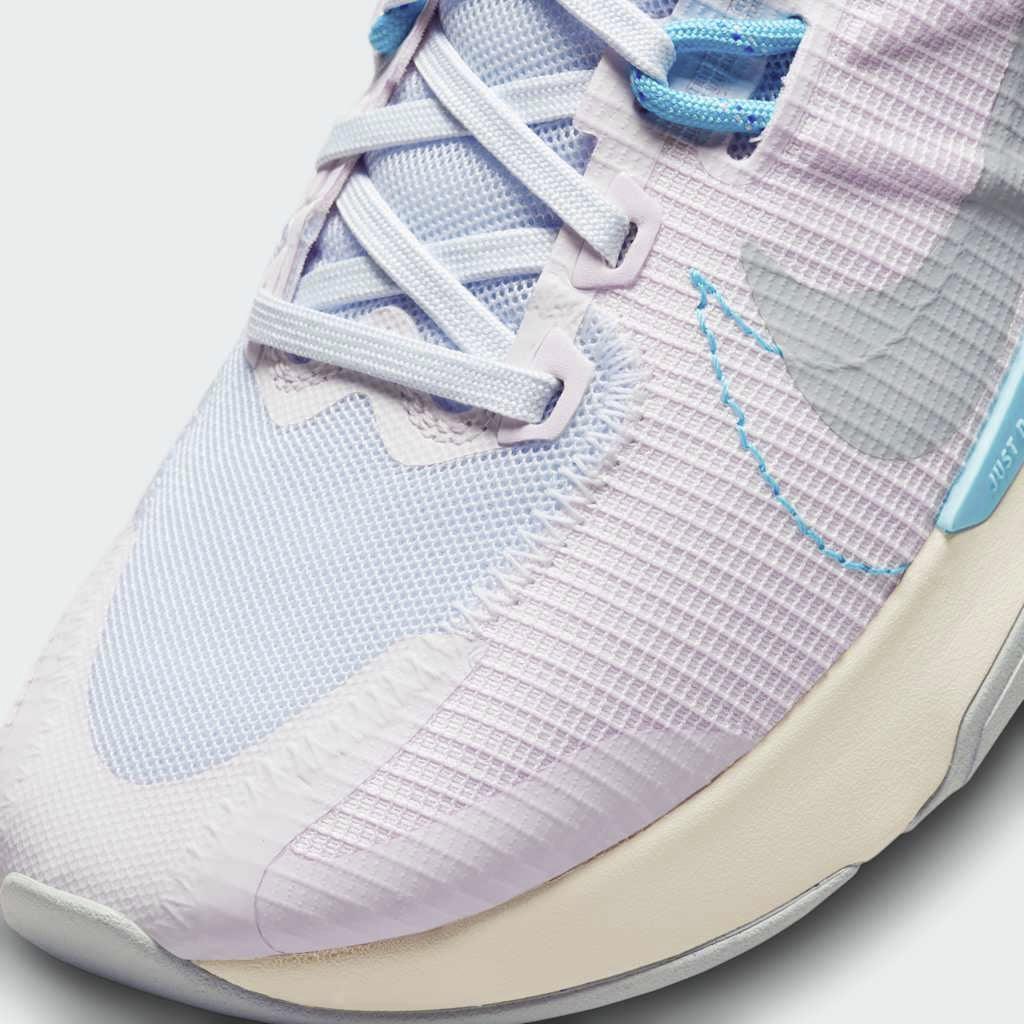 Close-up of Nike Juniper Trail 2 Women's Running Shoes DM0821-600 mesh texture, laces, and eyelets