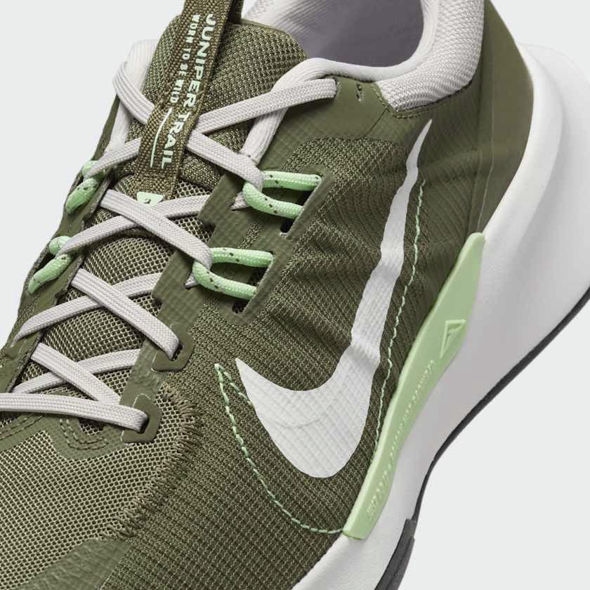 Close-up of Nike Juniper Trail 2 Next Nature Men's Trainers DM0822-200 showing breathable mesh texture, laces, and tongue logo