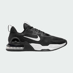 Nike Air Max Alpha Trainer 5 Men's shoes in black with white accents, side profile showing visible Max Air unit in the heel, durable mesh upper, and supportive overlays.