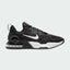 Nike Air Max Alpha Trainer 5 Men's shoes in black with white accents, side profile showing visible Max Air unit in the heel, durable mesh upper, and supportive overlays.