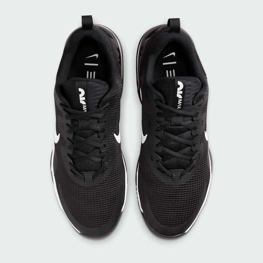 Top-down view of a pair of Nike Air Max Alpha Trainer 5 Men's shoes in black, highlighting their sturdy silhouette and lace-up closure.