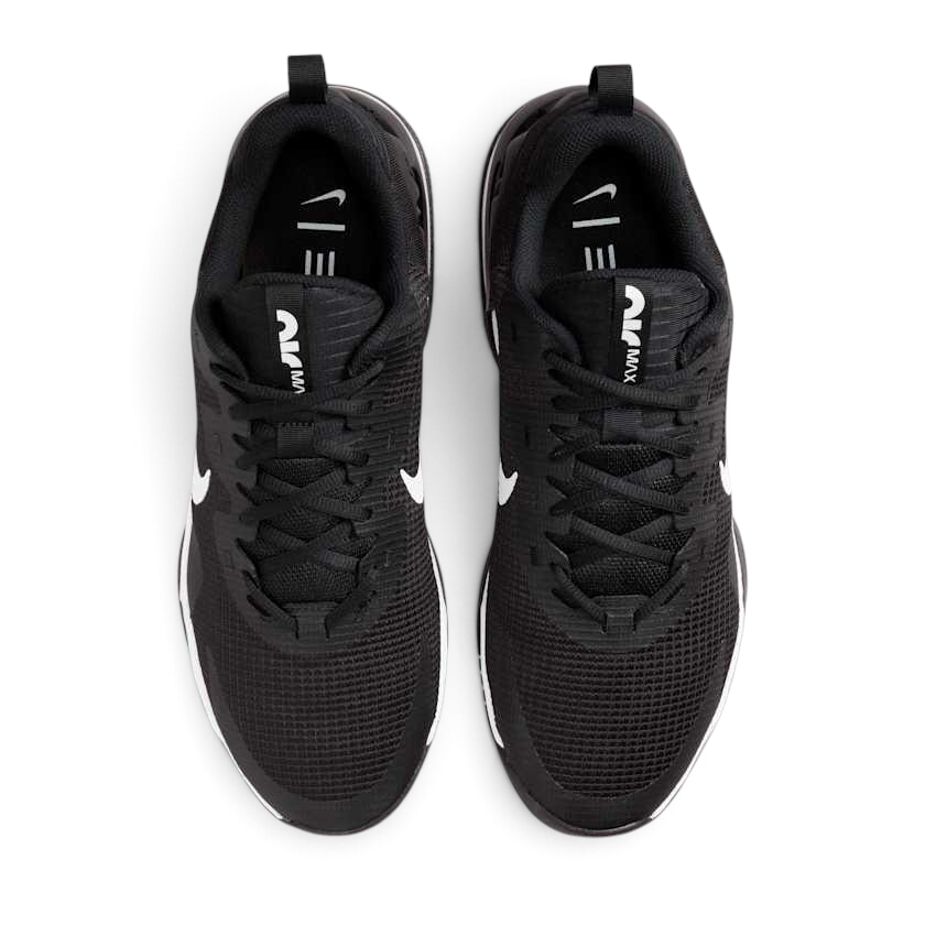 Top-down view of a pair of Nike Air Max Alpha Trainer 5 Men's shoes in black, highlighting their sturdy silhouette and lace-up closure.