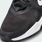 Close-up zoom on the front of the Nike Air Max Alpha Trainer 5 Men's black, showing the mesh upper texture, durable toe cap, and lacing system.