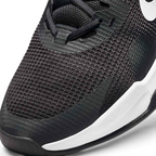 Close-up zoom on the front of the Nike Air Max Alpha Trainer 5 Men's black, showing the mesh upper texture, durable toe cap, and lacing system.